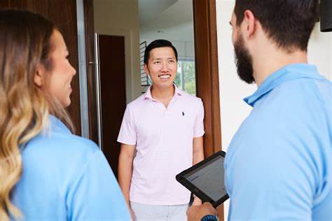 Two Employees Talking to the Customer